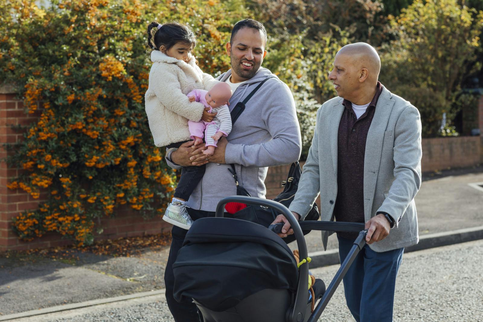 GettyImages-1288590113 south asian diaspora walking generation grandfather father baby