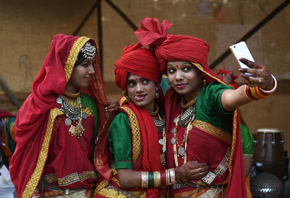 Indian artists from Madhya Pradesh take a selfie. (Sajjad Hussain/AFP/Getty Image)