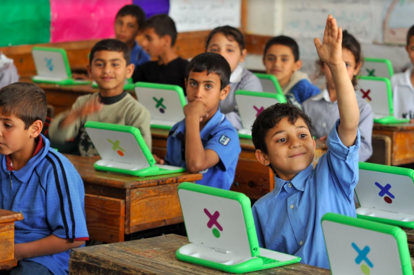 Students using the XO-1 laptop in a school in Gaza. (One Laptop Per Child)