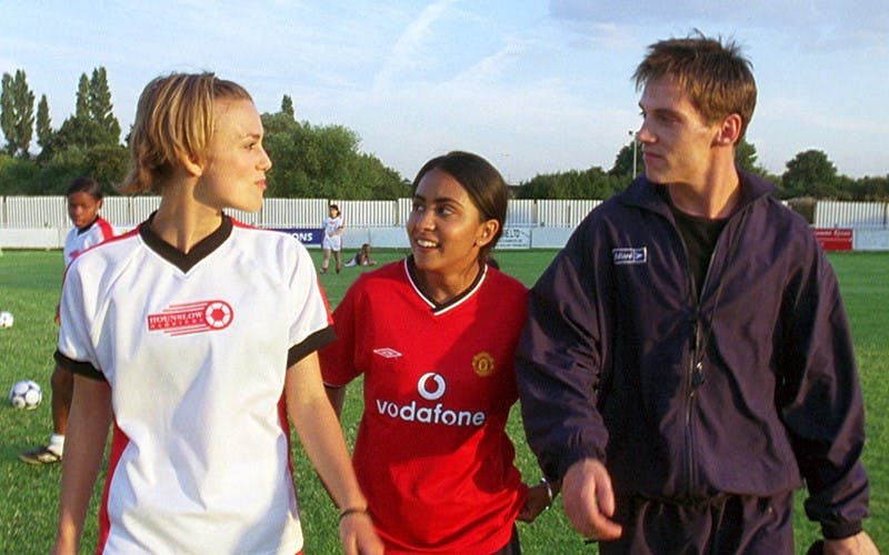 Jules (Keira Knightley), Jess (Parminder Nagra), and Joe (Jonathan Rhys-Myers) in Bend It Like Beckham