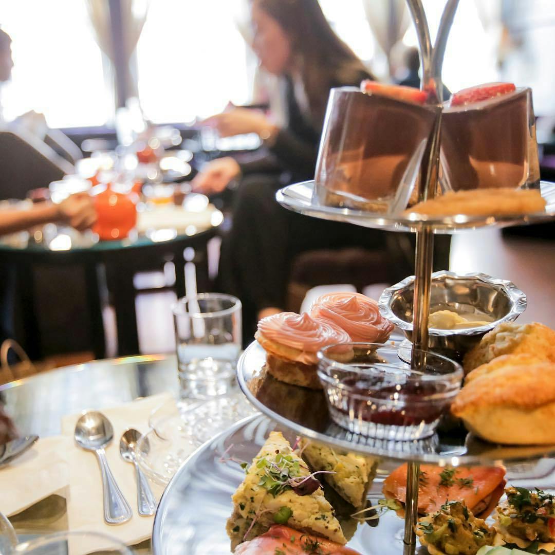 At Janam, guests are served a pot of tea and a three-tier tray of savories and sweets, including traditional foods like scones and egg salad. (Janam Tea)