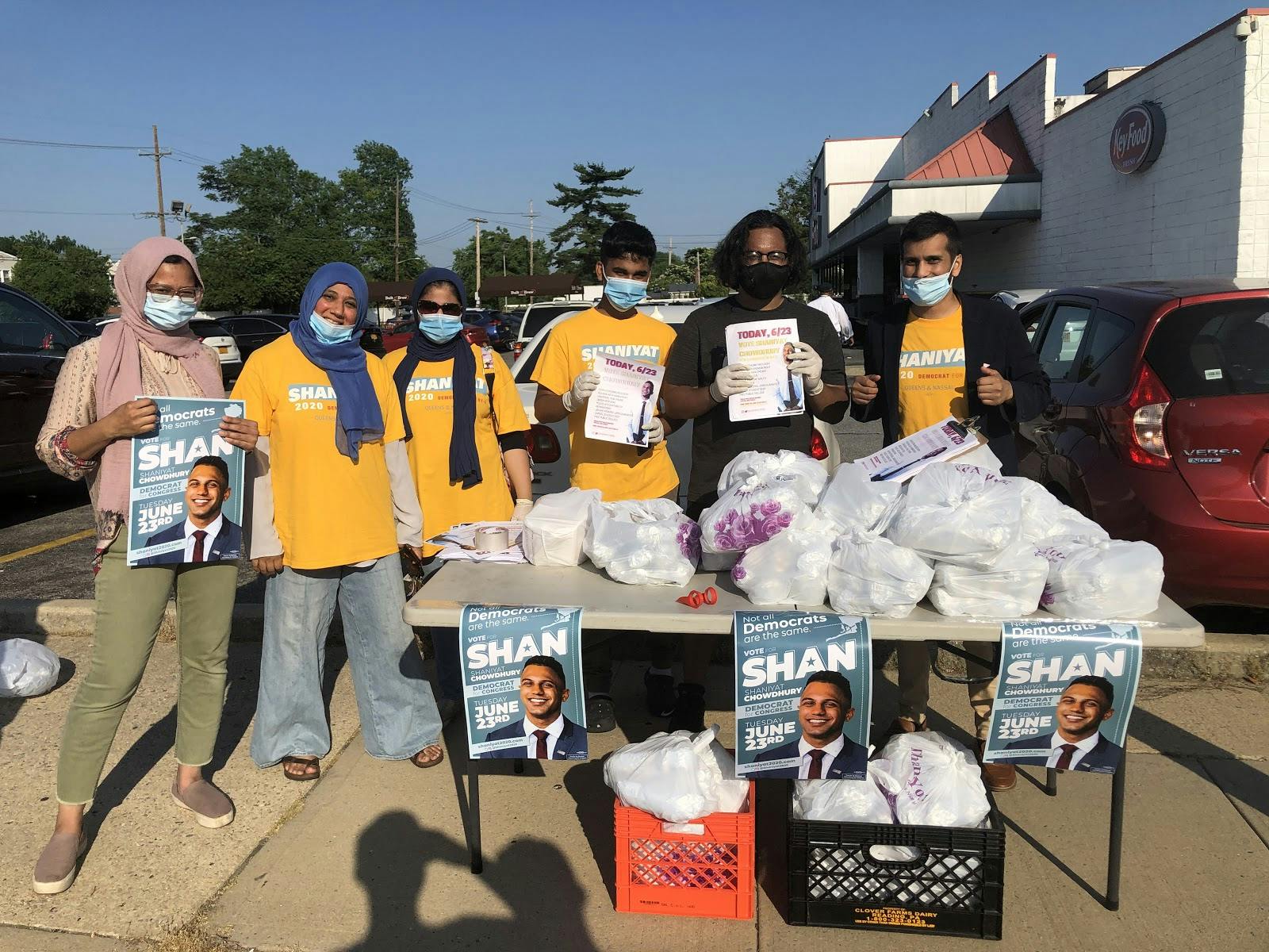 Volunteers for Long Island south Asian congressional candidate Shaniyat Chowdhury hand out gyros outside the legally mandated distance from a polling site in June. Photograph: Raihan Faroqui