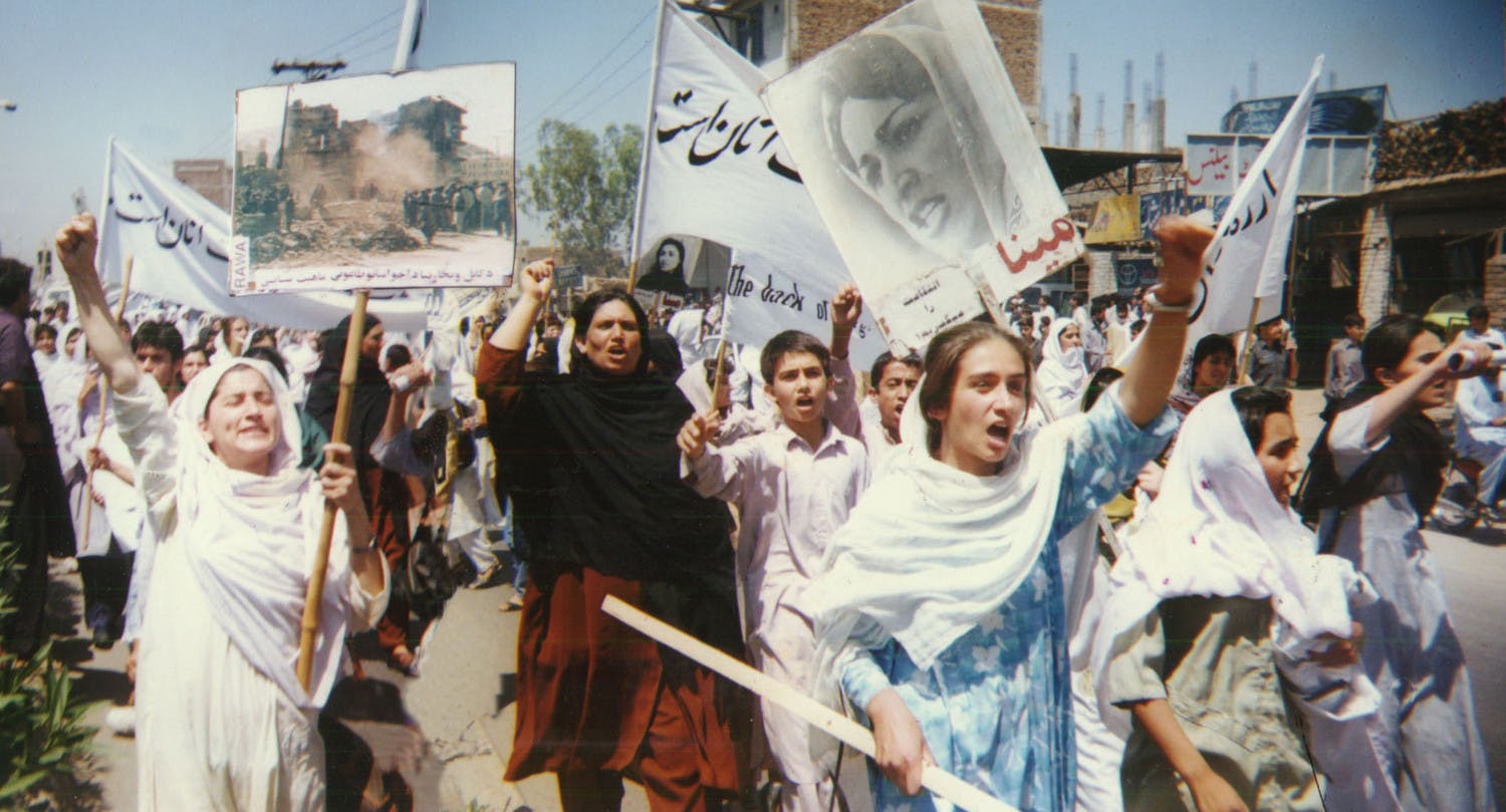 Demonstration of the Revolutionary Association of the Women of Afghanistan (RAWA) in Peshawar, Pakistan to condemn the 6th black anniversary of swarming of fundamentalists into Kabul, April 28,1998 (Wikimedia Commons)