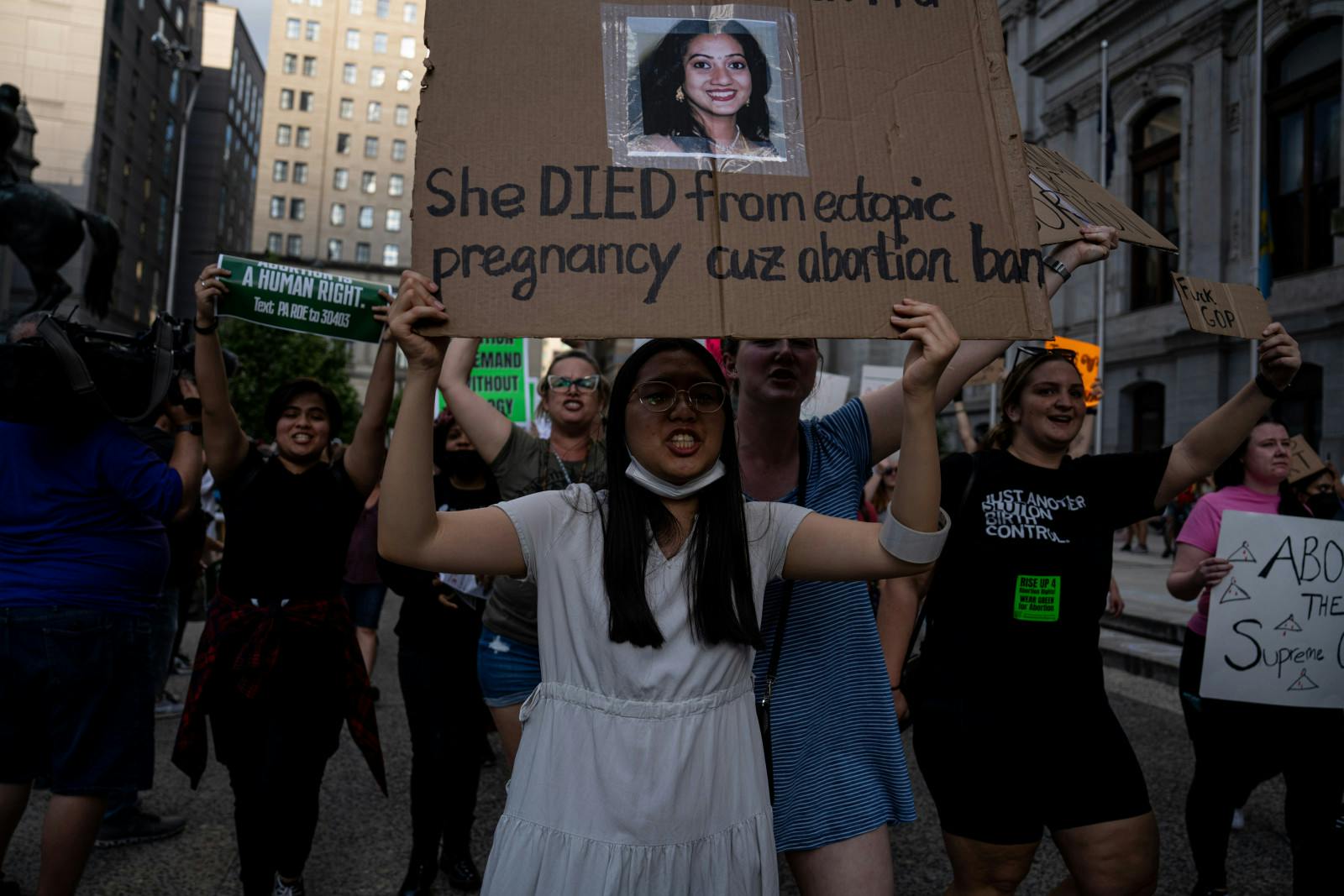 PHILADELPHIA, JUNE 24: Demonstrators gather outside of City Hall to protest the Supreme Court's verdict to overturn Roe vs Wade. Protester is holding up a sign for Savita Halappanavar, who died in Ireland due to not being able to access an abortion. (Wolfgang Schwan/Anadolu Agency via Getty Images)