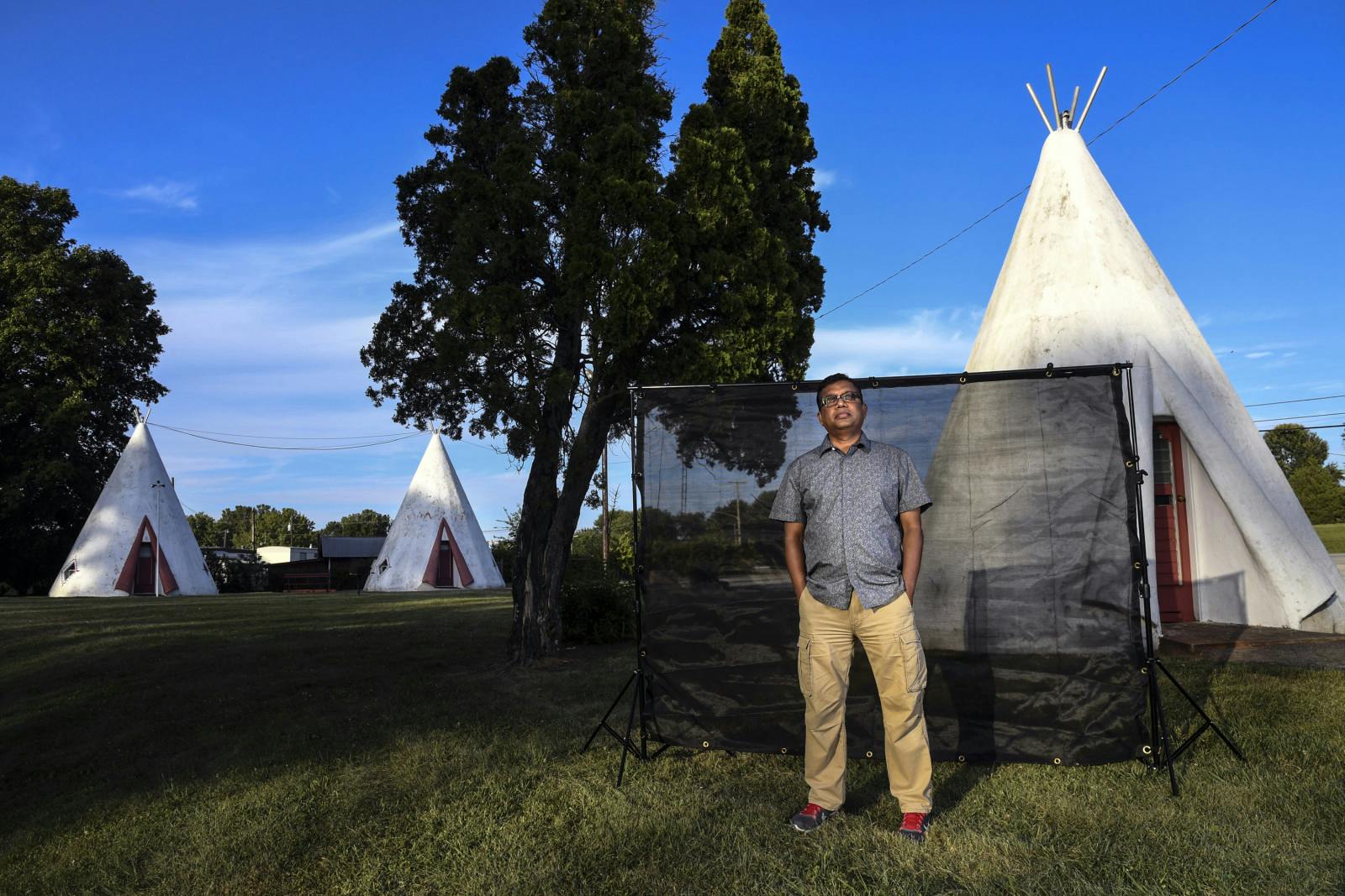 Sahidur Mir, 51, a green card holder from India, poses for a portrait in front of Wigwam Village #2, the roadside motel he owns in Cave City, Kentucky on July 31, 2017 (Toni L. Sandys/The Washington Post via Getty Images)