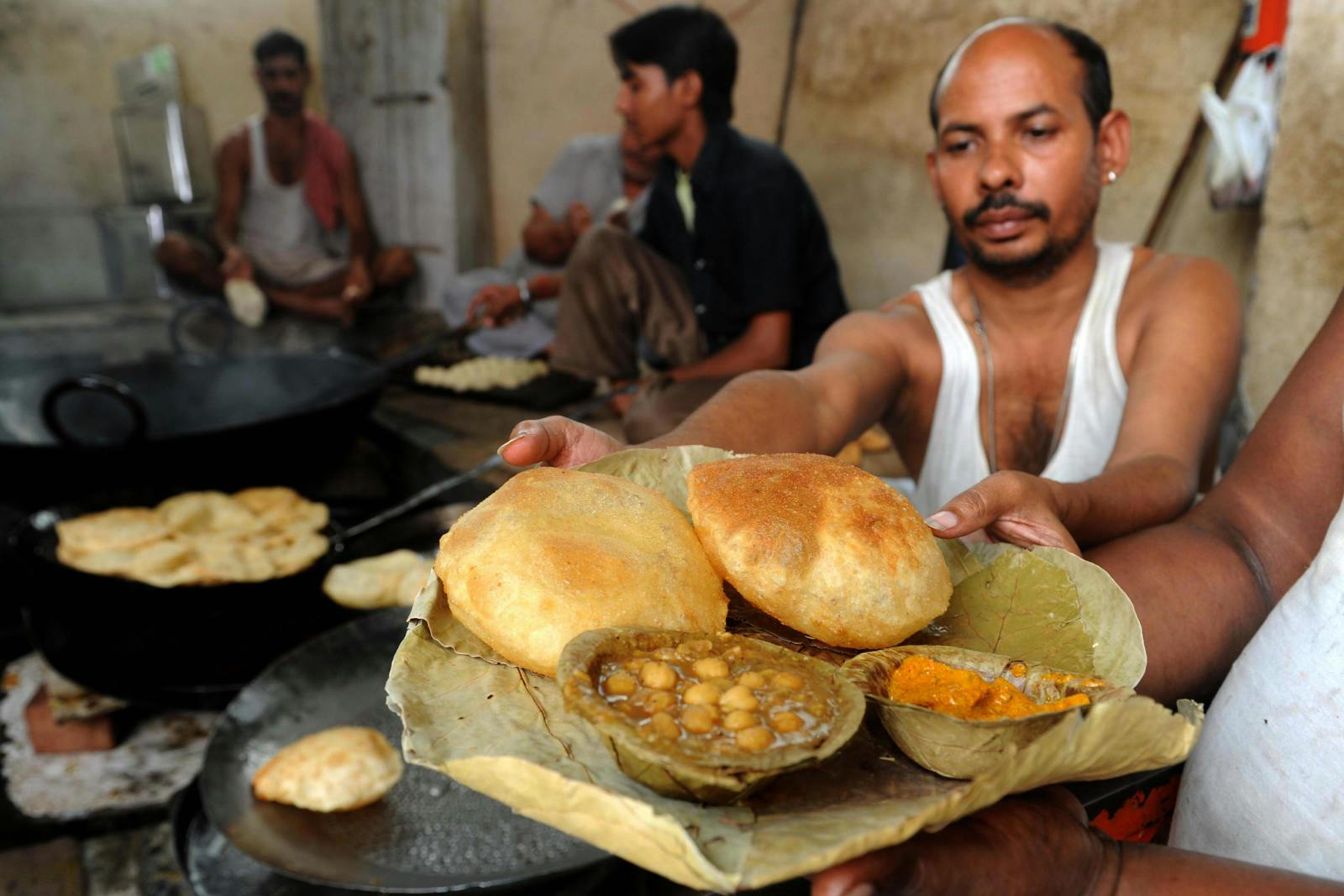 Pooris, chole masala, and pickles served up in Amritsar (NARINDER NANU/AFP via Getty Images)